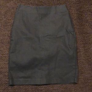 Women’s charcoal shiny black above knee skirt.